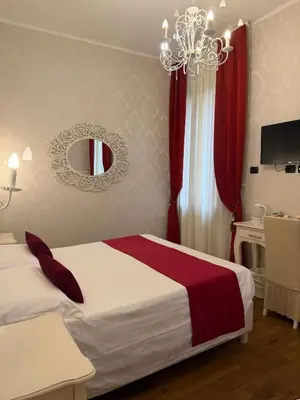 Letto o letti in una camera di Charming Palace Santa Fosca