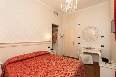 Letto o letti in una camera di Charming Palace Santa Fosca