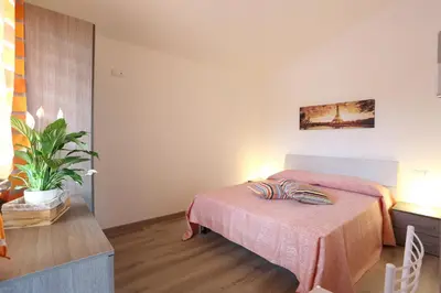Letto o letti in una camera di Villaggio Olmè