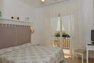 Letto o letti in una camera di Hotel Conchiglia