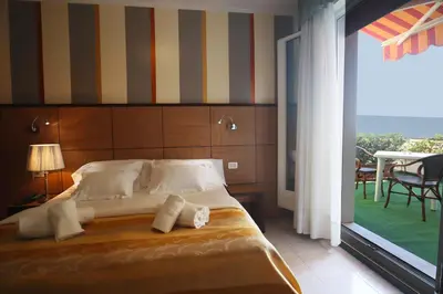 Letto o letti in una camera di Hotel Righetto Fronte Mare