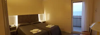 Letto o letti in una camera di Hotel Righetto Fronte Mare
