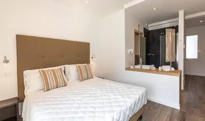 Letto o letti in una camera di Hotel Mayer