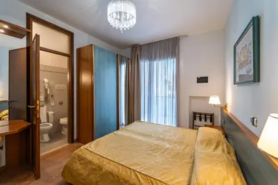 Letto o letti in una camera di Hotel Souvenir