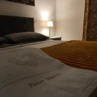 Letto o letti in una camera di Casa vacanza Piazza Marconi