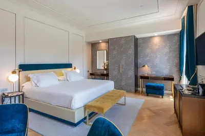 Letto o letti in una camera di H10 Palazzo Canova