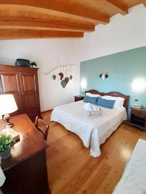 Letto o letti in una camera di Agriturismo Le Cipressine