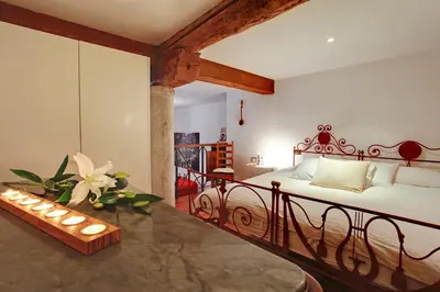 Letto o letti in una camera di Ca' Cortigiane Suite by Ca Cortigiane