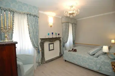 Letto o letti in una camera di Corte dei Santi