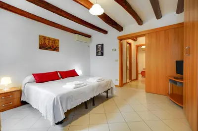 Letto o letti in una camera di B&B Giardini