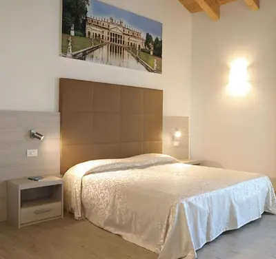 Letto o letti in una camera di Agriturismo Corte Foscara