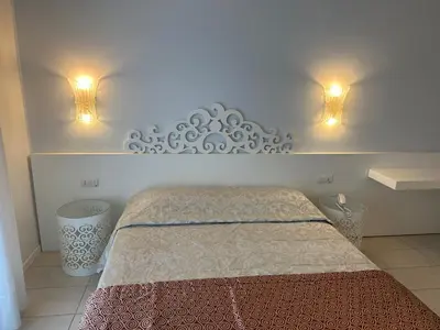 Letto o letti in una camera di Hotel Albatros 3 Stelle Superior