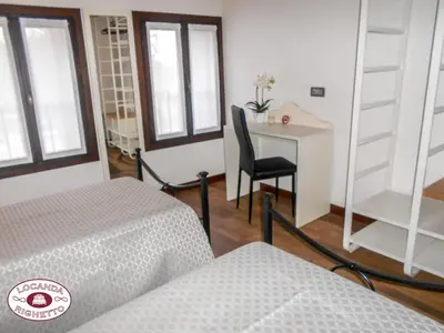 Letto o letti in una camera di LOCANDA RIGHETTO
