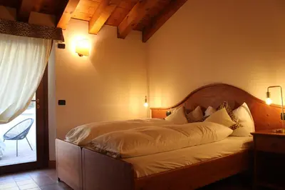 Letto o letti in una camera di Agriturismo Al Credazzo