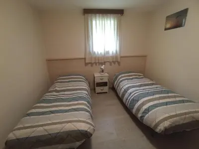 Letto o letti in una camera di vololiberoapartments