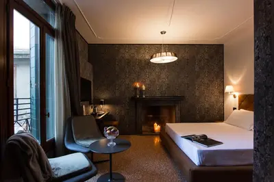Letto o letti in una camera di Riva del Vin BOUTIQUE HOTEL