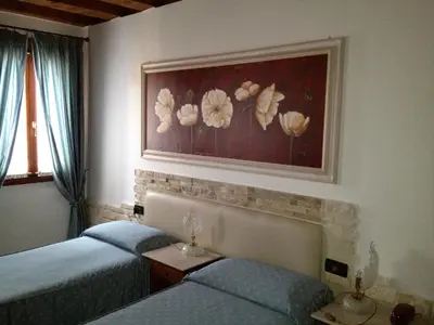 Letto o letti in una camera di Ca'Nova Alloggi