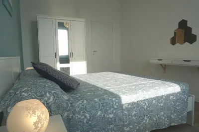 Letto o letti in una camera di Appartamento Tramonto