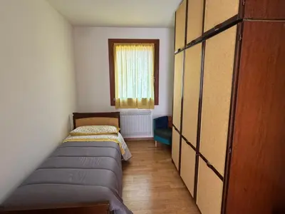 Letto o letti in una camera di Cà Maria - Appartamento con Giardino