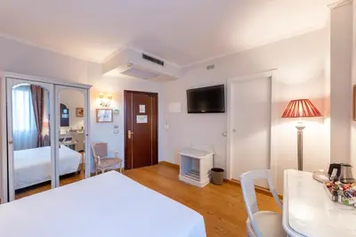 Letto o letti in una camera di Majestic Toscanelli (centro storico)