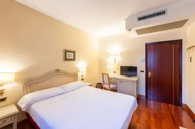 Letto o letti in una camera di Majestic Toscanelli (centro storico)