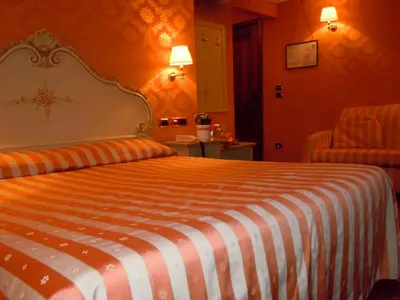 Letto o letti in una camera di Hotel Lux