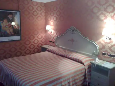 Letto o letti in una camera di Hotel Lux