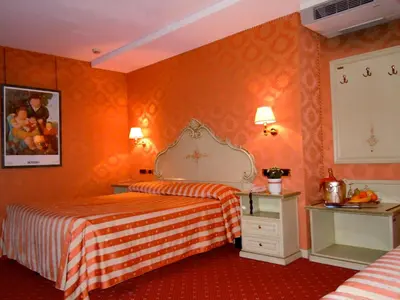 Letto o letti in una camera di Hotel Lux