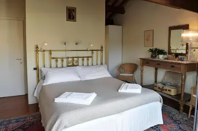 Letto o letti in una camera di B&B Vicenza San Rocco