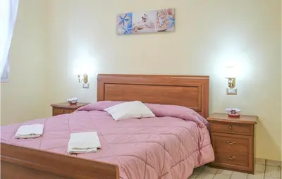 Letto o letti in una camera di Casa Marina
