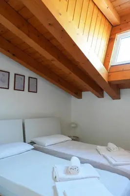 Letto o letti in una camera di Dainese Apartments, Casa Abigail