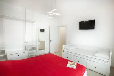 Letto o letti in una camera di Casa Nives