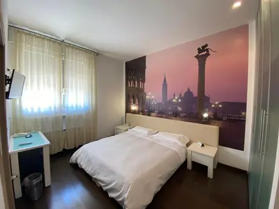 Letto o letti in una camera di Hotel Angi