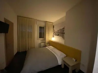 Letto o letti in una camera di Hotel Angi