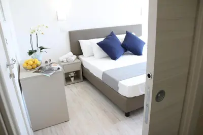 Letto o letti in una camera di Hotel Arena