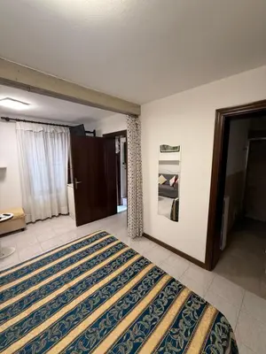 Letto o letti in una camera di Appartamento Carboncina