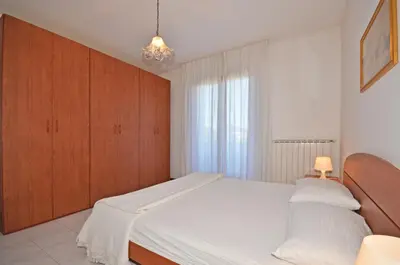 Letto o letti in una camera di Residence Perla