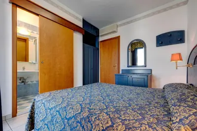 Letto o letti in una camera di Hotel Garni San Carlo