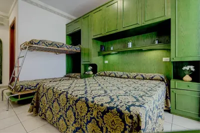 Letto o letti in una camera di Hotel Garni San Carlo