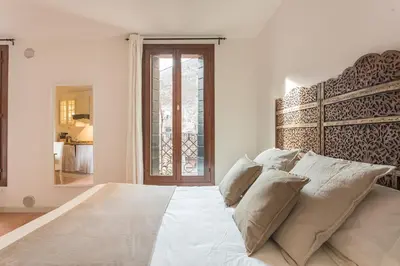 Letto o letti in una camera di Studio Ago27 by Welc(H)ome