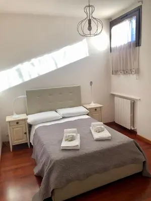 Letto o letti in una camera di Palazzo Bianchetti