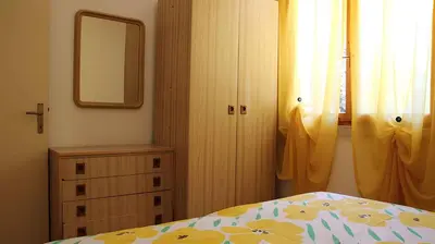 Letto o letti in una camera di Apartments in Rosolina Mare 35721