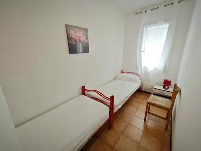 Letto o letti in una camera di Apartments in Rosolina Mare 35721