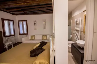 Letto o letti in una camera di Golden Suite