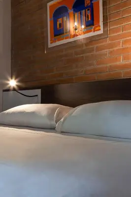 Letto o letti in una camera di Antico Caminetto alla Biennale