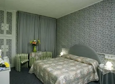 Letto o letti in una camera di Hotel Il Burchiello