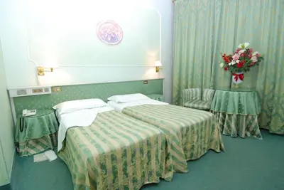 Letto o letti in una camera di Hotel Il Burchiello