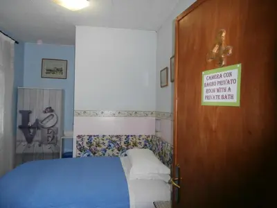 Letto o letti in una camera di Albergo Junior