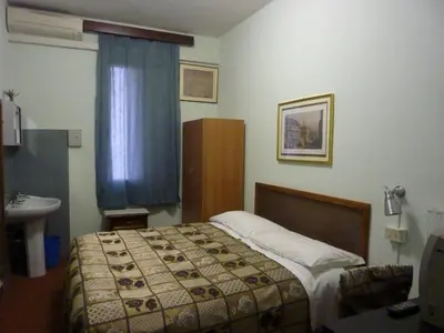 Letto o letti in una camera di Albergo Junior