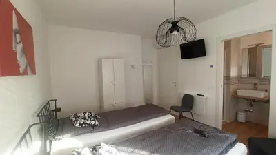 Letto o letti in una camera di DESDEMA & OPERA Rooms